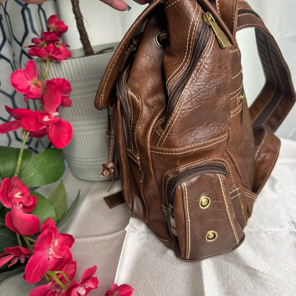 Brown Leather Backpack with Gold Accents